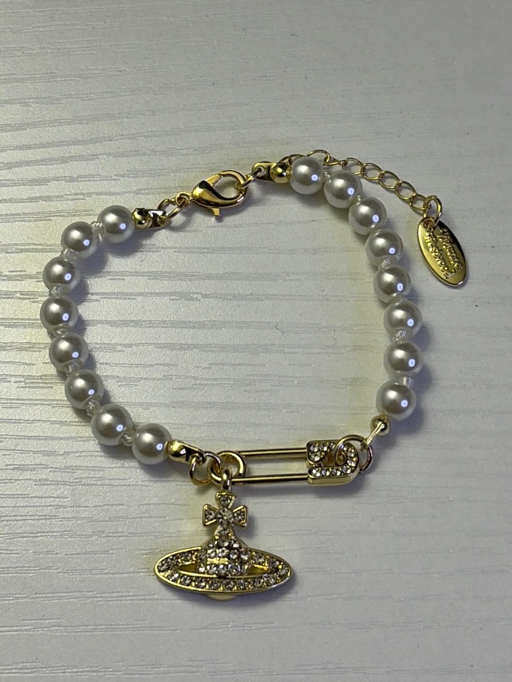 Vivienne Westwood Gold-Tone Pearl Charm Bracelet with Orb Pendant